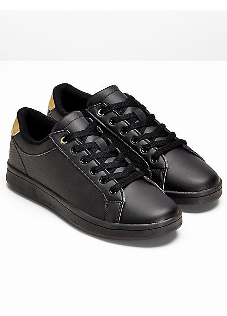 gold coloured trainers